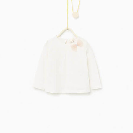 Top with embroidery and bow