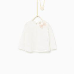 Top with embroidery and bow